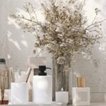 Skincare products with a floral arrangement.