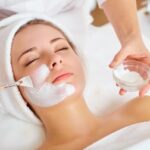 Woman receiving a facial treatment.